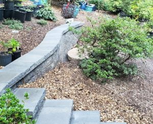 new retaining wall, steps & mulched beds
