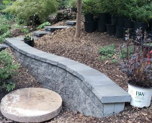 new retaining wall, steps & mulched beds plantings